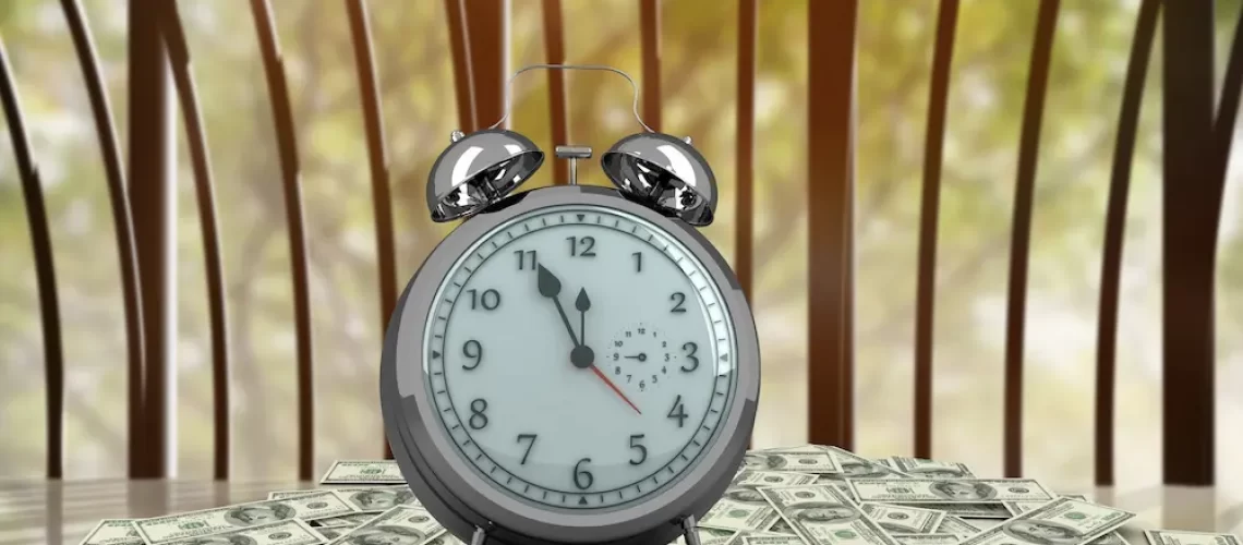 clock-with-banknotes-wooden-table